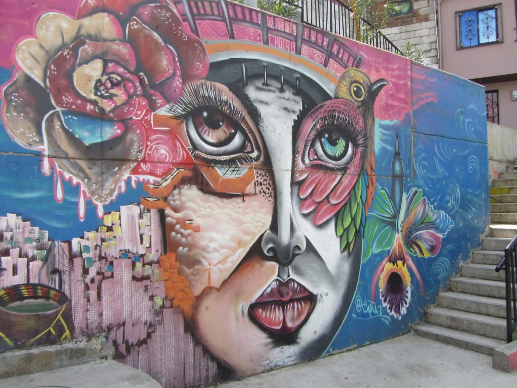 Street mural of a woman's face in Comuna 13