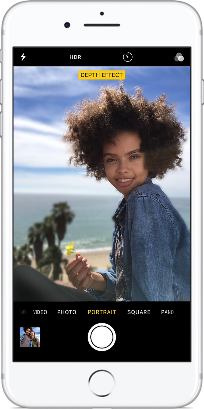 Woman smiling in a photo taken in portrait mode