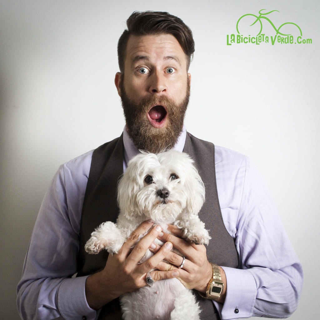 Peter Lewis of La Bicicleta Verde with his dog, a white Maltese